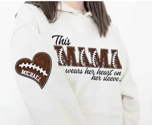 This Mama wears her heart on her sleeve football